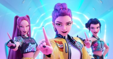 This image released by Netflix shows characters, from left, Mira, Rumi and Zoey in a scene from "KPop Demon Hunters." (AP Photo)