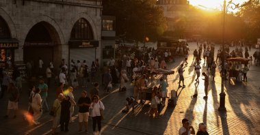 People walk in the famous Eminönü neighborhood during sunset, Istanbul, Türkiye, Aug. 2024. (EPA Photo)