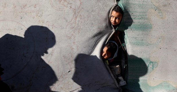 Children look on from a shelter in the Nuseirat camp for displaced Palestinians in the central Gaza Strip, Palestine, Dec. 22, 2025. (AFP Photo)