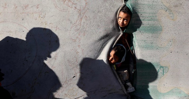 Children look on from a shelter in the Nuseirat camp for displaced Palestinians in the central Gaza Strip, Palestine, Dec. 22, 2025. (AFP Photo)