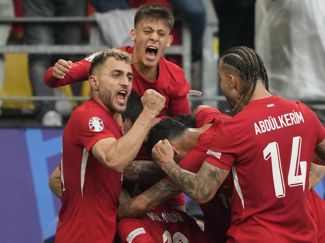 Türkiye's players celebrate after Mert Muldur's goal during a Group F match against Georgia at the Euro 2024 tournament, Dortmund, Germany, June 18, 2024. (AP Photo)