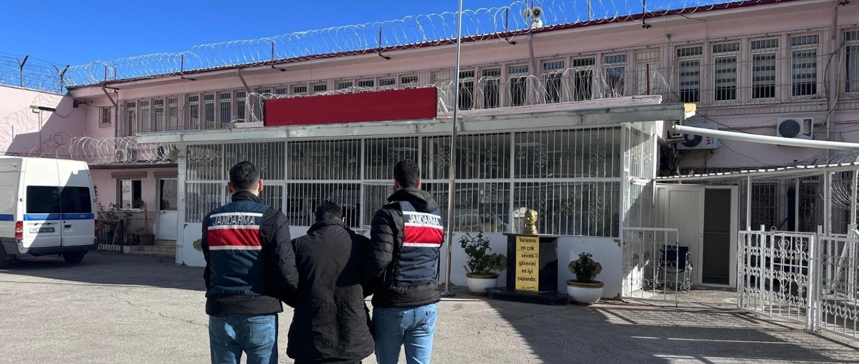 Gendarmerie officers escort a Daesh terrorist group fugitive who was arrested during a dawn operation in Gaziantep, Türkiye, Dec. 21, 2025. (IHA Photo)
