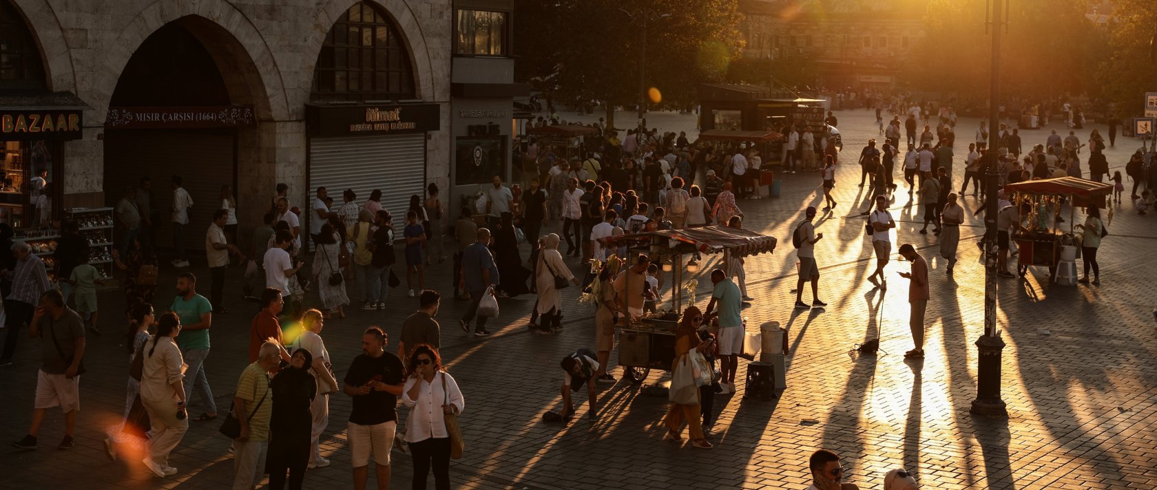 People walk in the famous Eminönü neighborhood during sunset, Istanbul, Türkiye, Aug. 2024. (EPA Photo)
