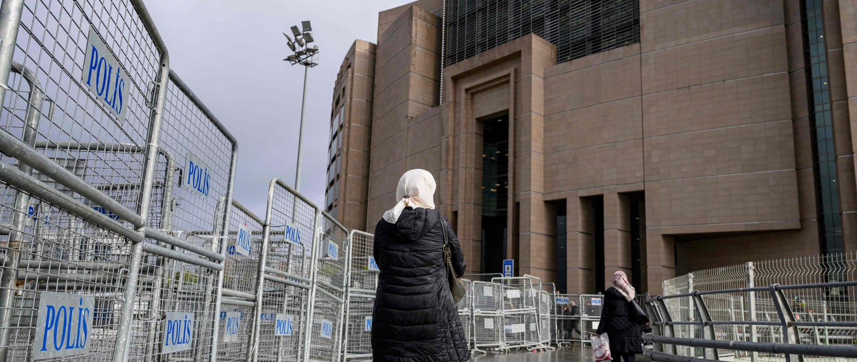The mother of Ibtissem B waits outside Çağlayan Courthouse, in Istanbul, Dec. 23, 2025. (AFP Photo)