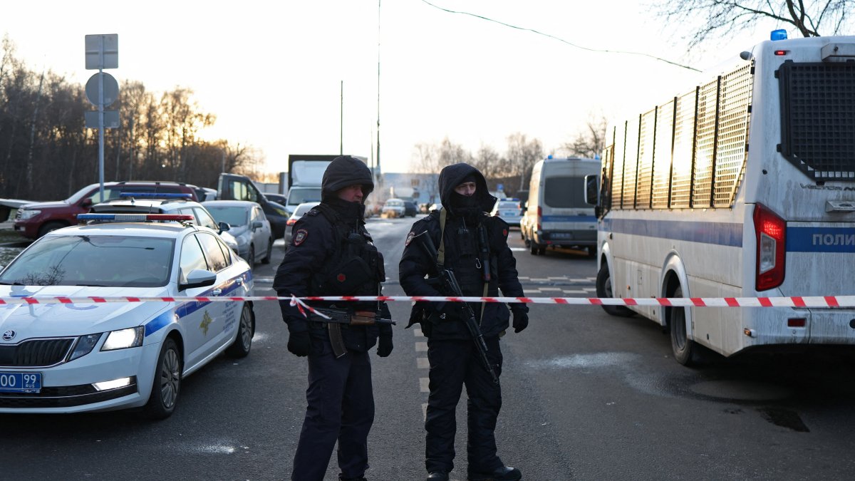 Law enforcement officers block the road near the scene where two traffic police officers and another person were killed in a blast in Moscow, Russia, Dec. 24, 2025. (Reuters Photo)