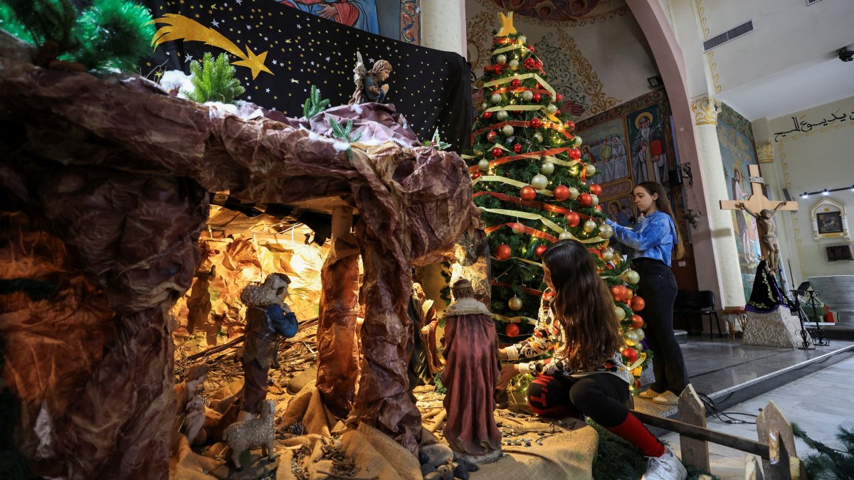 Palestinian Christian girls decorate the Holy Family Church, as the community prepares modest Christmas celebrations after two years of war, in Gaza City, Palestine, Dec. 9, 2025. (Reuters Photo)