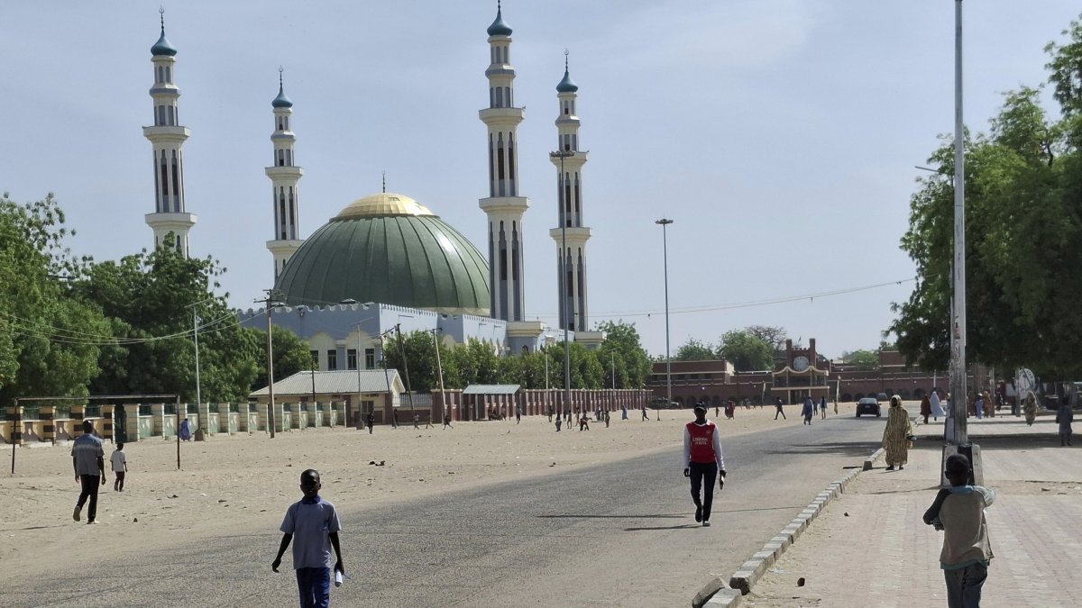 People walk past a mosque in Maiduguri, Nigeria, March 14, 2025. (AP Photo)