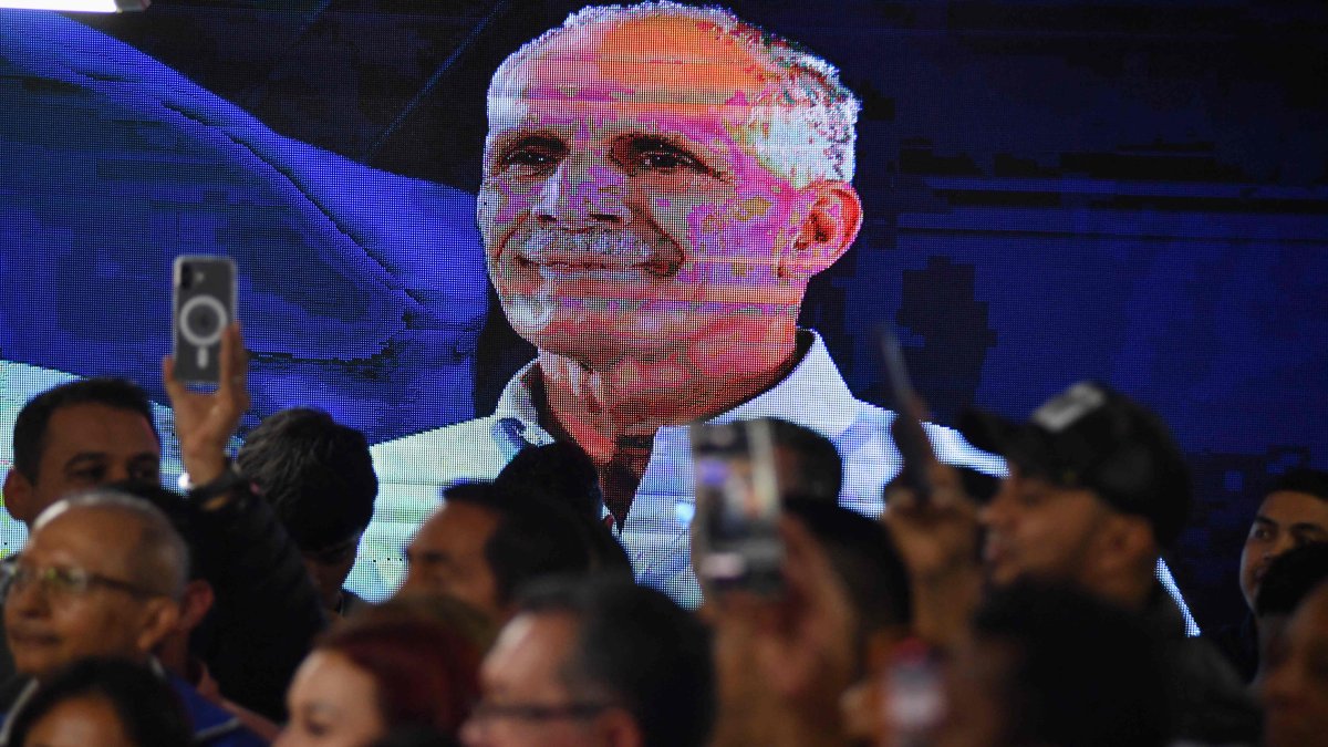 An LCD screen displays a portrait of Honduras presidential candidate Nasry Asfura of the National Party, as supporters celebrate after the National Electoral Council (CNE) declares him the winner of the Honduras Presidential Election in Tegucigalpa, Honduras, Dec. 24, 2025. (AFP Photo)