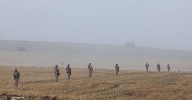 Turkish soldiers on patrol as search and rescue operations continue at the wreckage site following the crash, Ankara, Türkiye, Dec. 24, 2025. (AFP Photo)