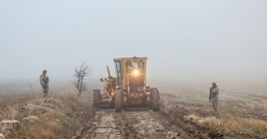 Soldiers patrol as search and rescue operations continue at the wreckage site following the crash of a Libya-bound business jet carrying Libyan Chief of Staff General Muhammad Ali Ahmed Al-Haddad, found 2 kilometers south of Kesikkavak Village at Haymana district in Ankara, Türkiye, Dec. 24, 2025. (AFP Photo)