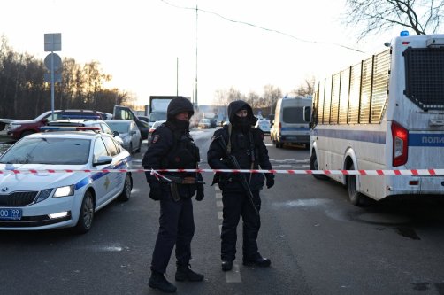 Law enforcement officers block the road near the scene where two traffic police officers and another person were killed in a blast in Moscow, Russia, Dec. 24, 2025. (Reuters Photo)