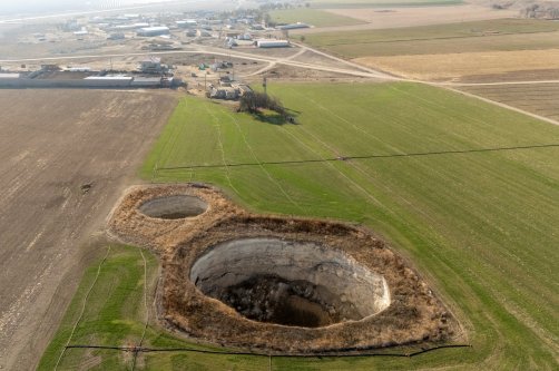 A drone view shows sinkholes formed in the middle of a farmland in Konya province, Türkiye, Dec. 18, 2025. (Reuters Photo)