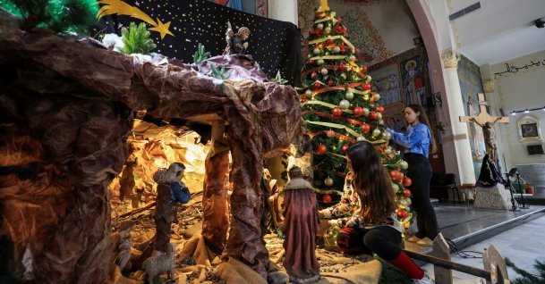 Palestinian Christian girls decorate the Holy Family Church, as the community prepares modest Christmas celebrations after two years of war, in Gaza City, Palestine, Dec. 9, 2025. (Reuters Photo)