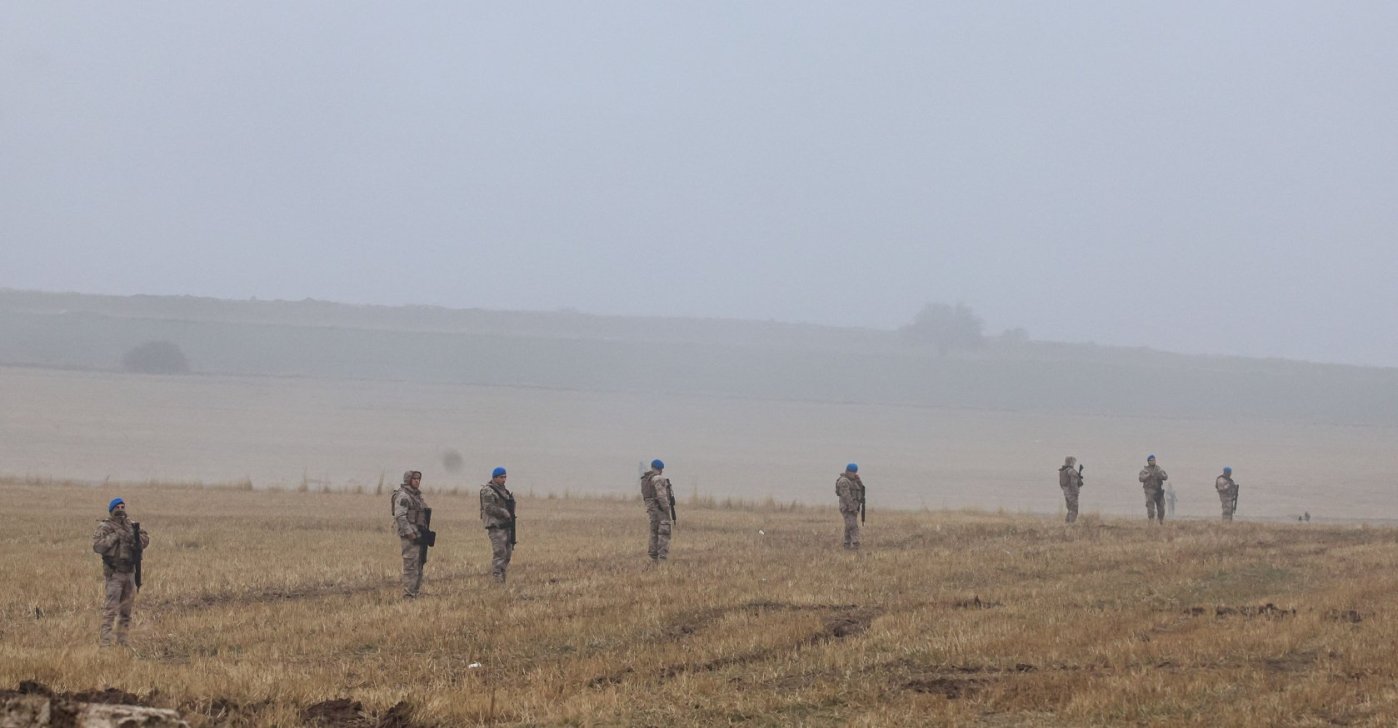 Turkish soldiers on patrol as search and rescue operations continue at the wreckage site following the crash, Ankara, Türkiye, Dec. 24, 2025. (AFP Photo)