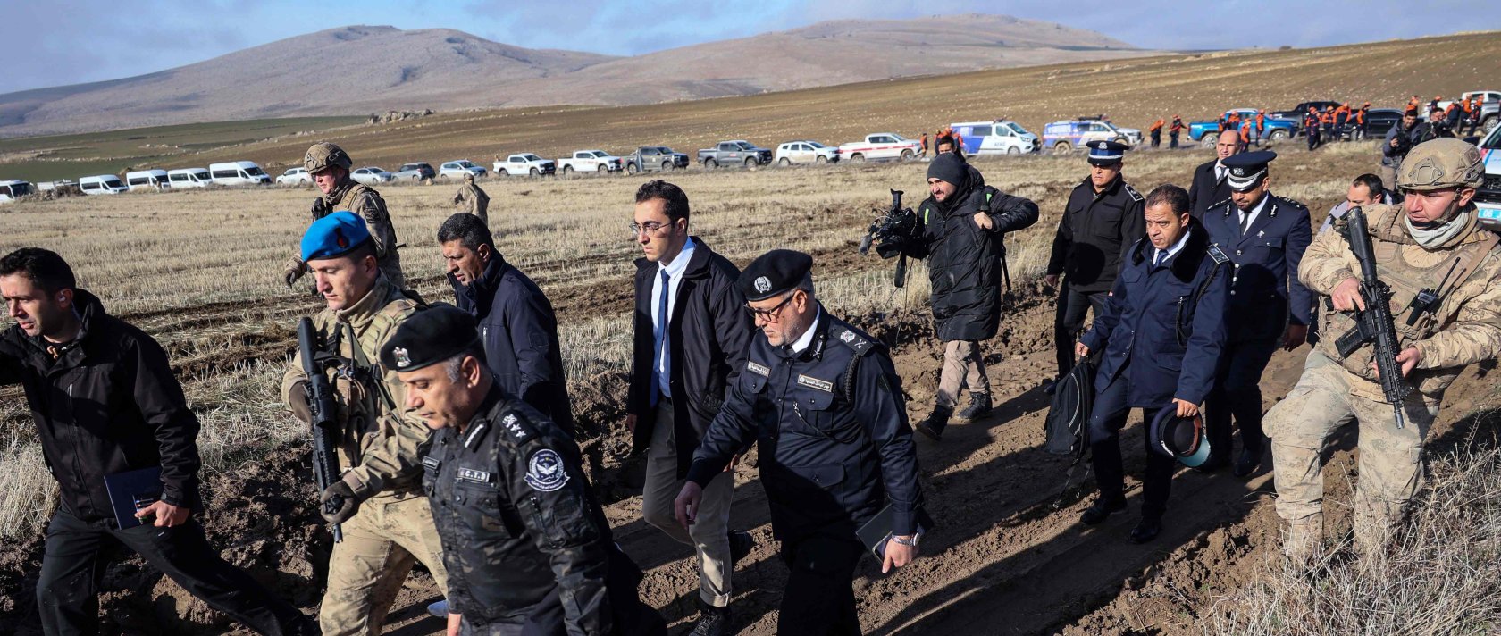Libyan military delegation members arrive at the wreckage site following the crash of a Libya-bound business jet carrying Libyan Chief of Staff General Muhammad al-Haddad, Ankara, Türkiye, Dec. 24, 2025. (AFP Photo)