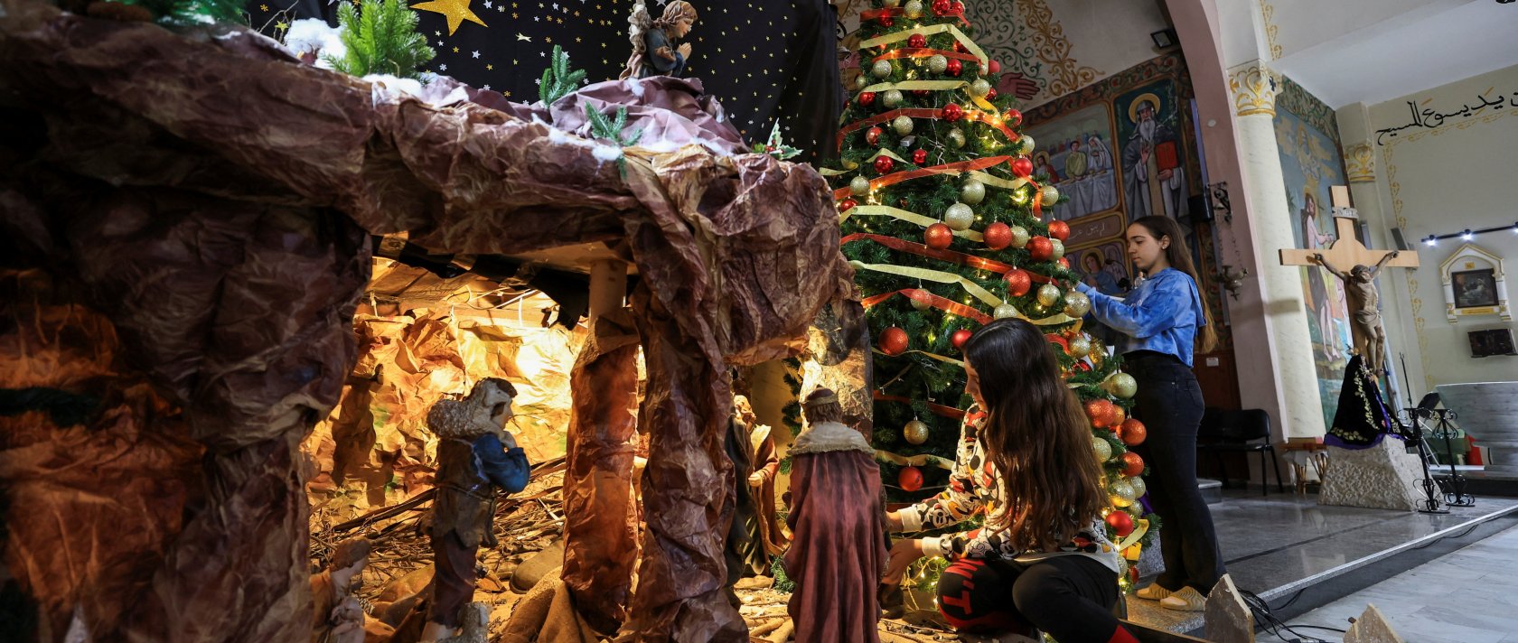 Palestinian Christian girls decorate the Holy Family Church, as the community prepares modest Christmas celebrations after two years of war, in Gaza City, Palestine, Dec. 9, 2025. (Reuters Photo)