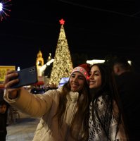 Palestinians take a photo in the Nativity Square with pilgrims and people before midnight mass at the Nativity Church in Bethlehem, in the Israeli-occupied West Bank, Dec. 24, 2025. (AFP Photo)
