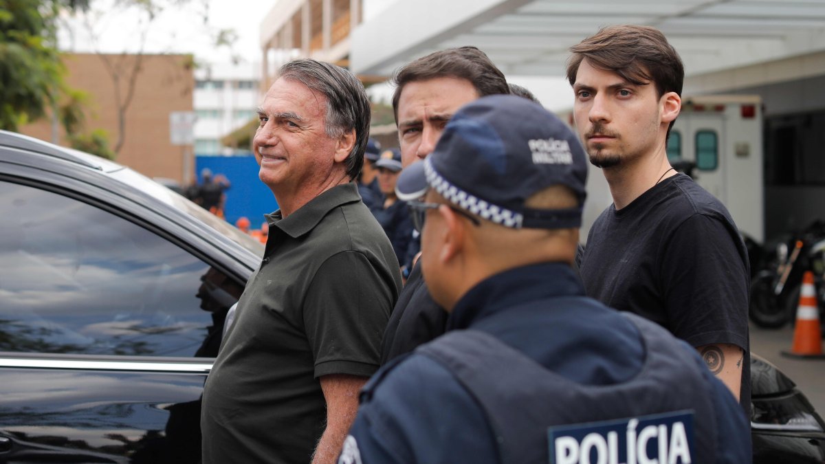 Bolsonaro backs son's Brazil presidential bid, undergoes hernia surgery