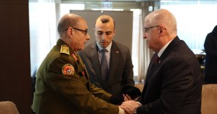 Defense Minister Yaşar Güler (R) extends condolences to Libyan officials who visited Türkiye to retrieve the bodies of crash victims, Ankara, Türkiye, Dec. 24, 2025. (İHA Photo)