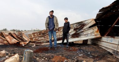 Palestinians assess a damaged site after Israeli settlers attacked their village of Deir Dibwan, in the Israeli-occupied West Bank, Dec. 15, 2025. (Reuters Photo)