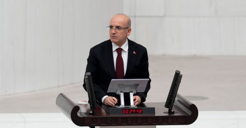 Treasury and Finance Minister Mehmet Şimşek speaks in front of Parliament, Ankara, Türkiye, Dec. 15, 2025. (AA Photo)
