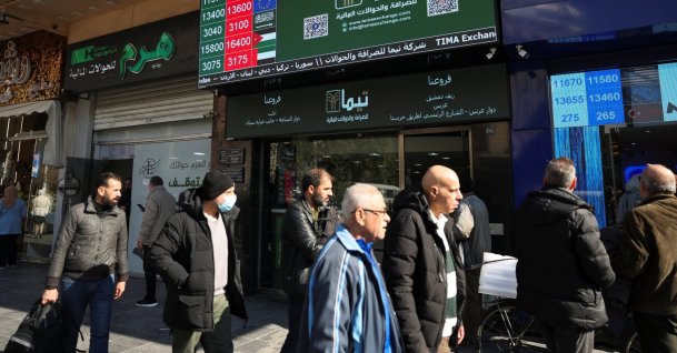 People pass by a currency exchange and money transfer shop in Damascus, Syria, Dec. 18, 2025. (Reuters Photo)