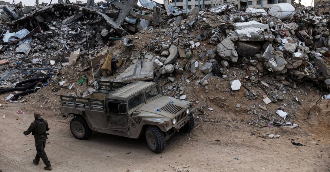 An Israeli soldier walks past a military vehicle and rubble in Rafah in the southern Gaza Strip, Dec. 8, 2025. (Reuters Photo)