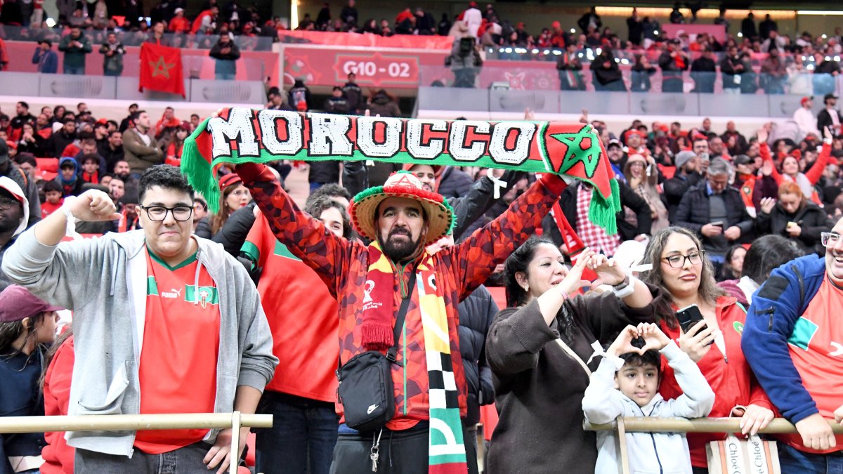 Moroccan fans wave national flags in the stands during the opening match of the Africa Cup of Nations (AFCON) against Comoros at Prince Moulay Abdellah Stadium, Rabat, Morocco, Dec. 21, 2025. (AA Photo)
