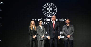 Culture and Tourism Minister Mehmet Nuri Ersoy (C), Eda Eca (L), Sinem Ünsal (2nd L) and Ozan Akbaba pose for a photo at a press conference held at the Atatürk Cultural Center (AKM), Istanbul, Türkiye, Dec. 26, 2025. (AA Photo)