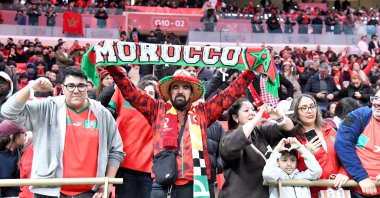 Moroccan fans wave national flags in the stands during the opening match of the Africa Cup of Nations (AFCON) against Comoros at Prince Moulay Abdellah Stadium, Rabat, Morocco, Dec. 21, 2025. (AA Photo)
