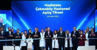 President Recep Tayyip Erdoğan cuts the ribbon with hospital staff during the inauguration ceremony, Istanbul, Türkiye, Dec. 26, 2025. (AA Photo) 