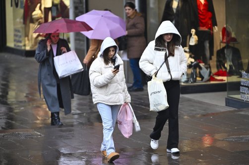 People walk during a rainy day, Ankara, Türkiye, Dec. 23, 2025. (AA Photo)