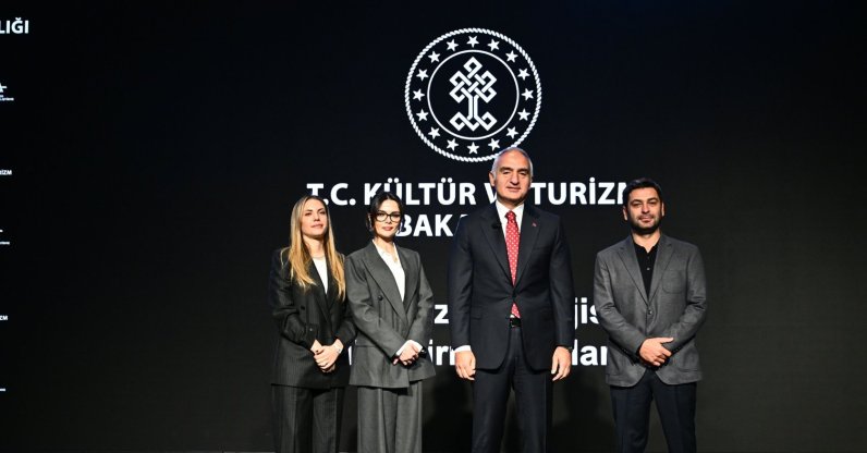 Culture and Tourism Minister Mehmet Nuri Ersoy (C), Eda Eca (L), Sinem Ünsal (2nd L) and Ozan Akbaba pose for a photo at a press conference held at the Atatürk Cultural Center (AKM), Istanbul, Türkiye, Dec. 26, 2025. (AA Photo)