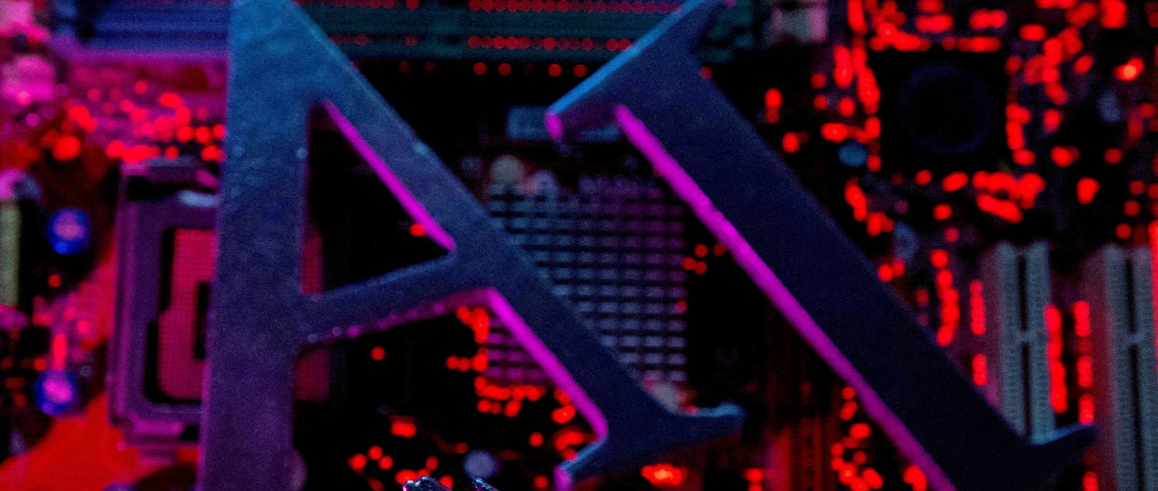 Letters spelling out "AI" and a robot hand are placed on a computer motherboard in this illustration created on June 23, 2023. (Reuters Photo)