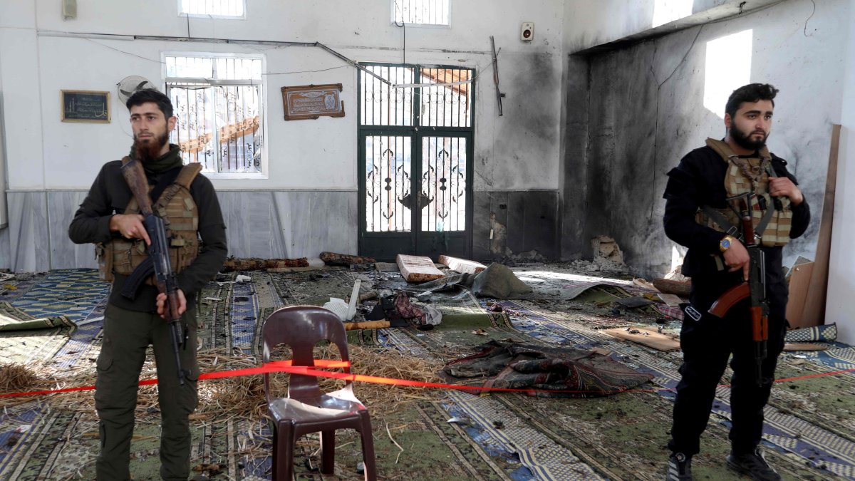 Armed security officers cordon off the area following an explosion inside Imam Ali ibn Abi Talib Mosque in the Wadi al-Dahab neighborhood of Homs, Syria, Dec. 26, 2025. (AFP Photo)