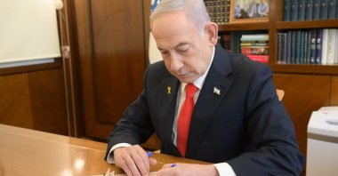 Israeli Prime Minister Benjamin Netanyahu signs the document recognizing Somaliland as an independent state, in Tel Aviv, Israel, Dec. 26, 2025. (IHA Photo)