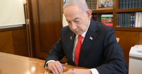 Israeli Prime Minister Benjamin Netanyahu signs the document recognizing Somaliland as an independent state, in Tel Aviv, Israel, Dec. 26, 2025. (IHA Photo)