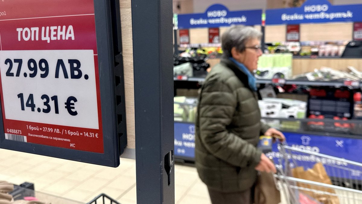 A woman shops inside a Lidl store, as prices are displayed in both the Bulgarian lev and euro currencies, Sofia, Bulgaria, Dec. 18, 2025. (Reuters Photo)