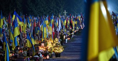 A photograph shows the graves of fallen Ukrainian soldiers decorated with Christmas trees and New Year's decorations at the Lychakiv Military Cemetery on the day before Christmas Eve, Lviv, Ukraine, Dec. 23, 2025. (AFP Photo)