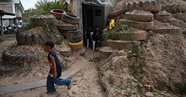 Children play around a bunker during clashes along the Thai-Cambodia border, in Surin province, Thailand, Dec. 10, 2025. (AFP Photo)