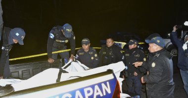 Guatemalan security forces remove victims' bodies from the scene of a bus accident near the town of Nahuala, Solola province, western Guatemala, Dec. 27, 2025. (EPA Photo)