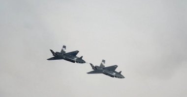 Two Bayraktar Kızılelma jets are seen airborne during close formation flight, Türkiye, Dec. 28, 2025. (AA Photo)