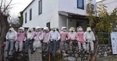 Handmade figures in village streets during the Oyuk Festival, reflecting Barbaros’ community-led cultural tourism identity in Urla, Izmir, Türkiye, Dec. 28, 2025. (DHA Photo)
