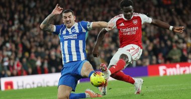 Brighton's Lewis Dunk (L) in action with Arsenal's Bukayo Saka (R) during an English Premier League match, in London, U.K, Dec. 27, 2025. (EPA Photo)