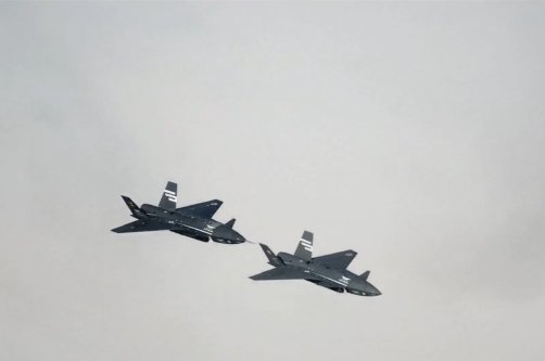 Two Bayraktar Kızılelma jets are seen airborne during close formation flight, Türkiye, Dec. 28, 2025. (AA Photo)