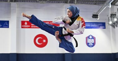 Türkiye's taekwondo star Kübra Dağlı shows off her moves during a training session, Istanbul, Türkiye, Dec. 18, 2025. (AA Photo)