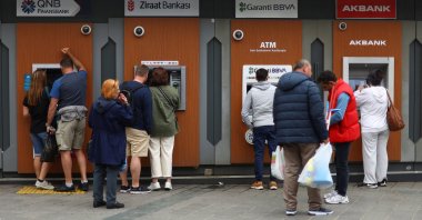 People use ATMs in Istanbul, Türkiye, May 29, 2023. (Reuters Photo)