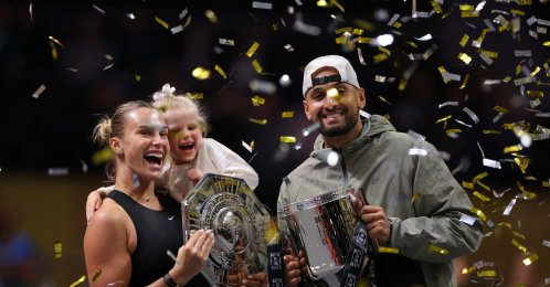 Belarus' Aryna Sabalenka (L), her goddaughter Nicole, and Australia's Nick Kyrgios celebrate with trophies after the 'Battle of the Sexes' match at the Coca-Cola Arena, Dubai, UAE, Dec. 28, 2025. (Reuters Photo)