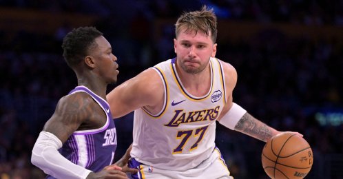 Sacramento Kings guard Dennis Schroder (L) defends Los Angeles Lakers guard Luka Doncic (77) during the NBA match at Crypto.com Arena, Los Angeles, U.S., Dec 28, 2025. (Reuters Photo)