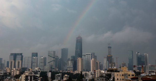 A rainbow is visible over the skyline during stormy weather, Tel Aviv, Israel, Dec. 11, 2025.